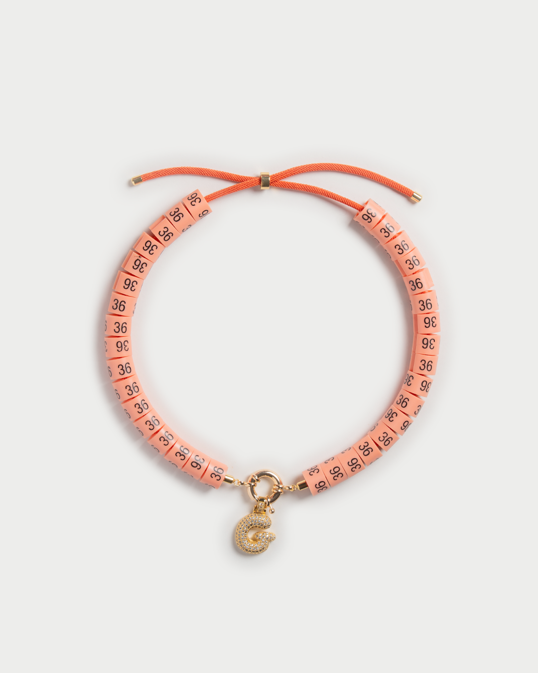 Necklace Ama in colors peach with bold pendant to keep you warm and relaxed 