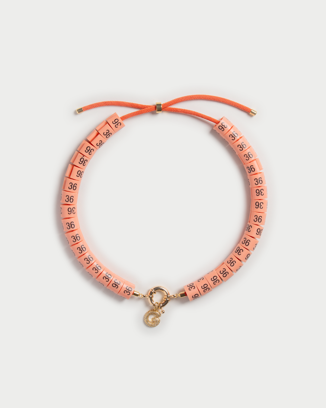 Necklace Ama in colors peach with slim pendant to keep you warm and relaxed 