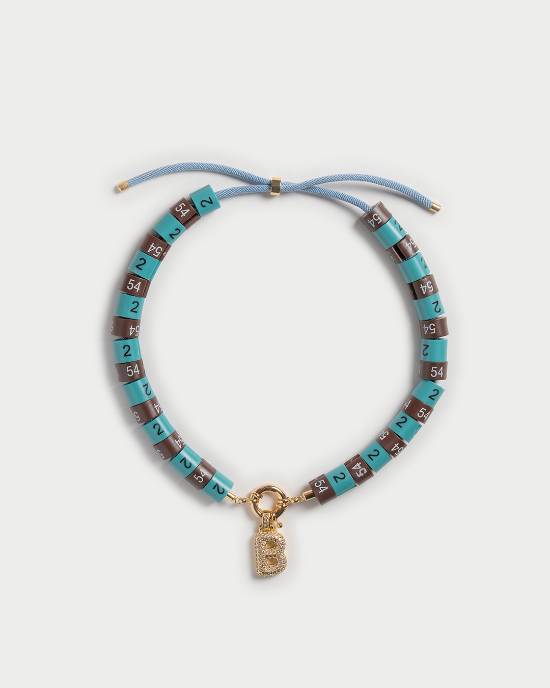 Necklace Era with bold pendant in colors turquoise and brown embody strength with a cool vibe