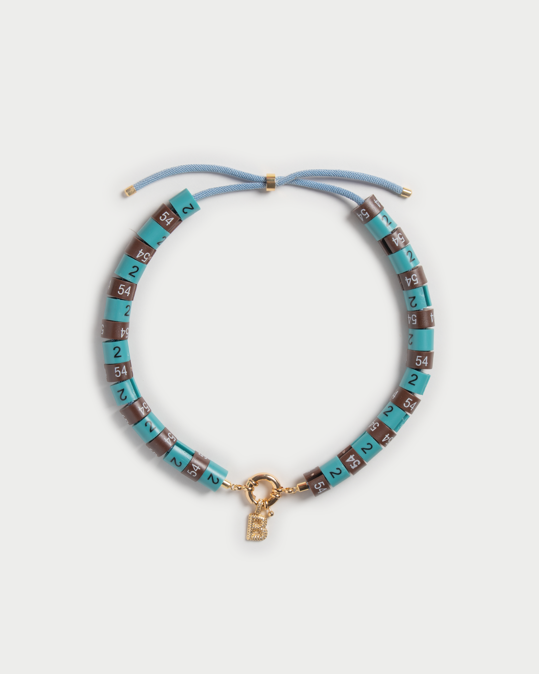 Necklace Era with slim pendant in colors turquoise and brown embody strength with a cool vibe