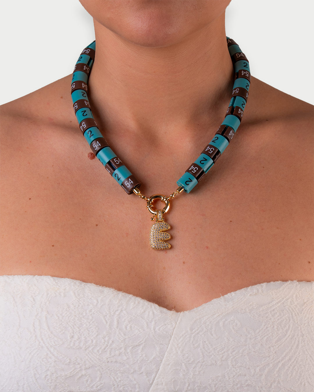 Necklace Era with bold pendant in colors turquoise and brown embody strength with a cool vibe