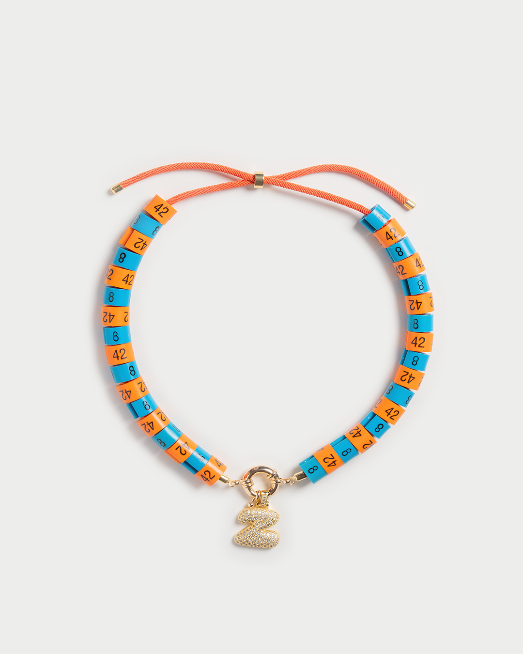 Necklace Helios in colors orange and blue with bold pendant inspired by the God of the sun