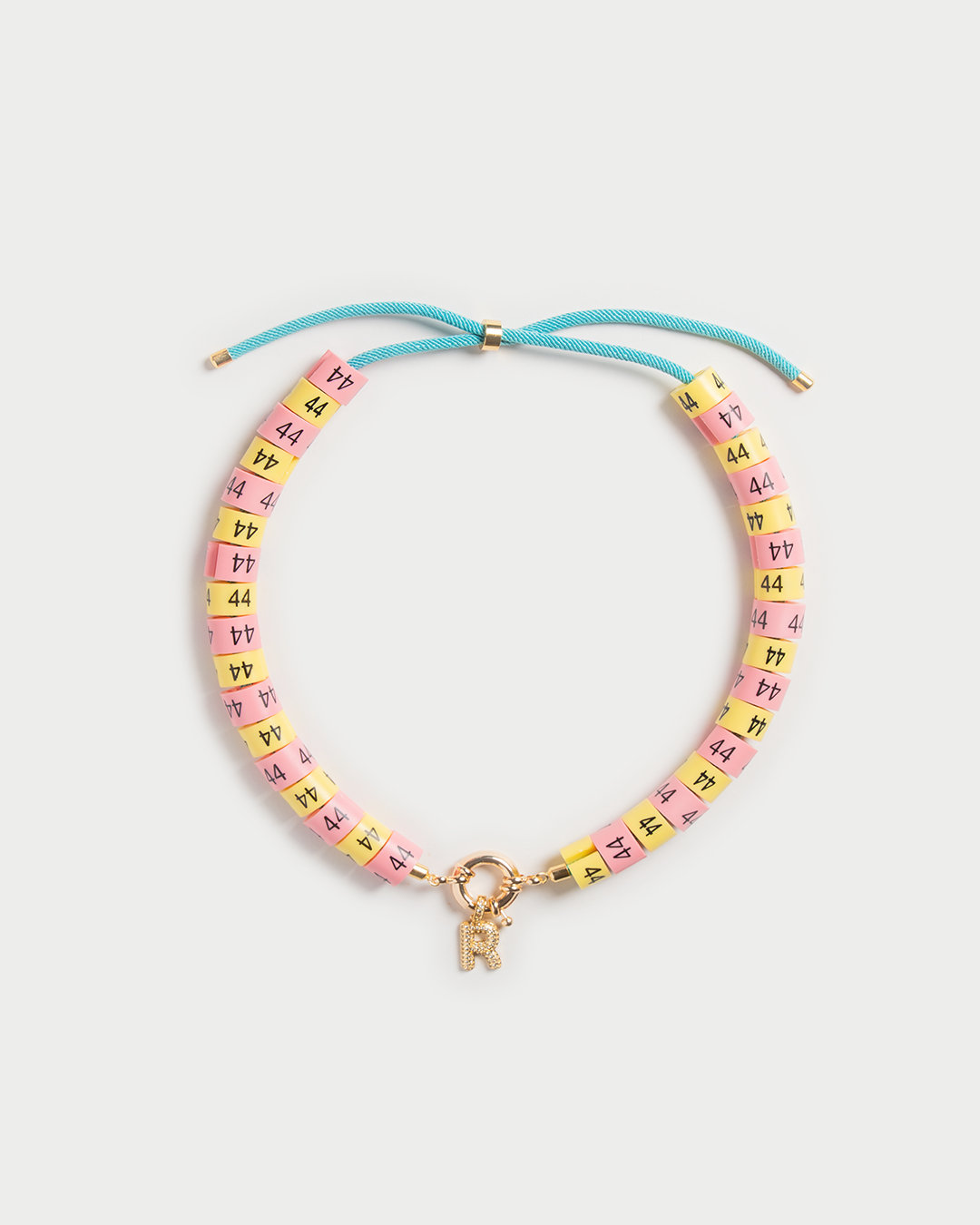 Necklace Luma in colors yellow and pink inspired by the sun with slim pendant