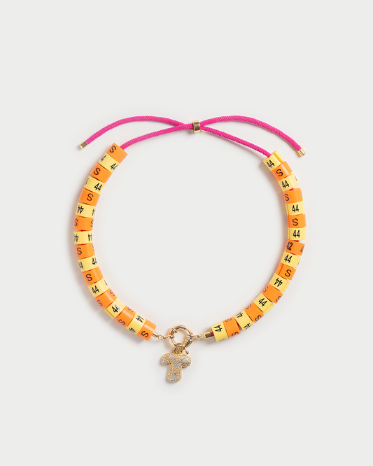 Necklace Raya with bold pendant in colors butter yellow and orange radiate golden hour energy and serenity
