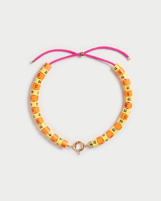 Necklace Raya in colors butter yellow and orange radiate golden hour energy and serenity in a unisex experience