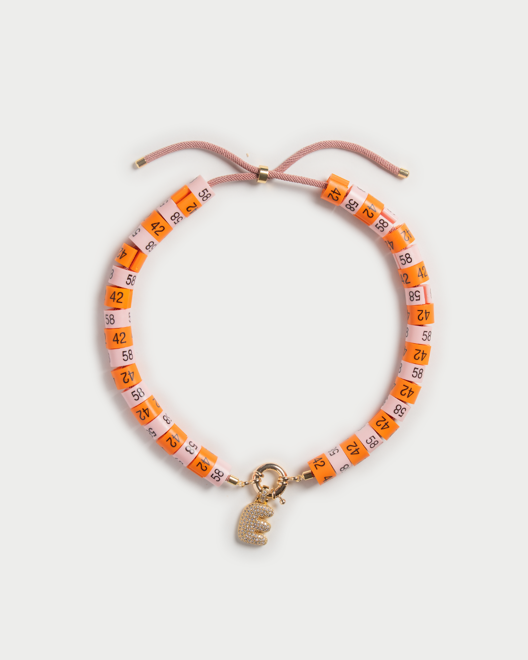 Necklace Soraya with bold pendant in colors orange and baby pink inspired by the sunset