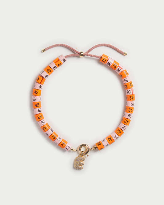 Necklace Soraya with bold pendant in colors orange and baby pink inspired by the sunset